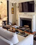 Grey sofa in living room with fireplace.