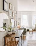 Small kitchen in apartment with gallery wall and narrow table