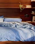 Bed with bedding from Parachute's line for Target