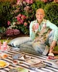 Designer Sheila Bridges having a picnic with various items from dinnerware line.