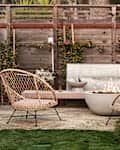 Concrete firepit in backyard.