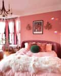Pink painted bedroom.