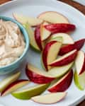A plate of apple slices with 3-ingredient peanut butter fruit dip