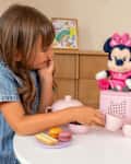 Child playing with Minnie Tonie.