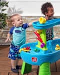 Kids playing with water table.