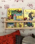 kids books on an IKEA bekvam spice rack shelf