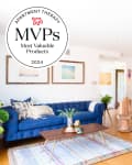 MVPs badge over living and dining room with blue sofa.