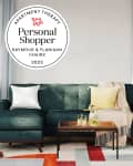 Photo of living room with Raymour and Flanigan sofa, armchair. Seal in upper left saying Apartment Therapy Personal Shopper: Raymour & Flanigan Chairs 2023