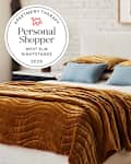 Bedroom with West Elm nightstand. Seal in upper left reads "Apartment Therapy Personal Shopper West Elm Nightstands 2025"