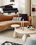 Espira Round Cream Marbled Resin Coffee Table in living room. Seal in upper left for Personal Shopper 2025 lead image.