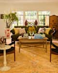 Iris Apfel Colorful Loom Mango Tufted Rug in living room.