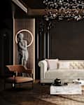 Luxurious living room with a tufted sofa, marble coffee table, modern chandelier, and a statue with a halo light.