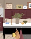 Cozy kitchen with dark wood cabinets, marble countertop, coffee machine, and decorative items like plants and candles.