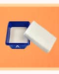 Blue container with a white cleaning block on an orange background.
