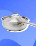 Stainless steel saucepan with lid and long handle on a blue abstract background.