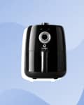 Black Magic Bullet air fryer with a dial on a blue wavy background.