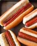 Hot Dogs in the Oven on a sheet tray.