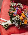 Wedding bouquet on armchair.