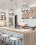 white kitchen with waterfall kitchen island