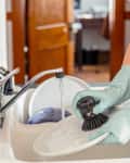 Woman washing dishes