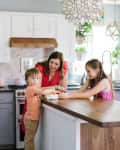 Laurel Harry in kitchen with children.