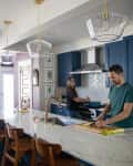 Andrea Surette and husband in kitchen.
