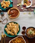 thanksgiving feast with turkey and other sides on table