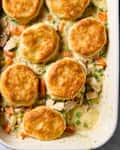 Overhead shot of chicken pot pie casserole in a white pan.