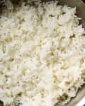 A pot of cooked white jasmine rice.