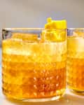 2 gold rush cocktails in rocks glasses