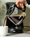 coffee being poured into a mug.