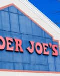 Trader Joe's store sign with red letters on a blue background.