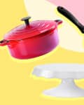 Red Dutch oven, black frying pan, and white cake stand on colorful background.