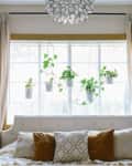 A bedroom with a semi flush-mount decorative light