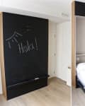 Murphy bed with blackboard front, "Hola!" written, transforms into a white bed in a modern room.
