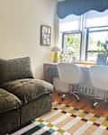 Cozey Green Gaia sofa in colorful living room.