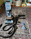 Bissell hydrosteam vacuum on rug.
