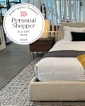 Bed on display at the Blu Dot store with Personal Shopper seal in upper left