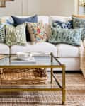 Pottery Barn living room with coffee table featured and personal shopper seal in upper left