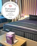 Bed at the Purple Mattress store with Personal Shopper seal in the upper left