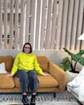 Alexa testing a sofa at the Article store with a personal shopper seal ih the upper left