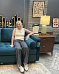 Emma Dangel sitting on Joybird's Briar Sleeper Sofa.