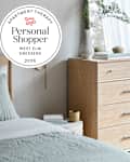 West Elm dresser in bedroom with personal shopper seal in upper left
