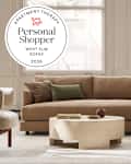 West Elm sofa in living room with personal shopper seal in upper left