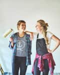 two young woman busy with renovations at home