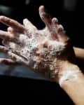 Young man washing hands