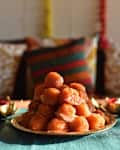 Arrangement of lamps and laddoos during Diwali celebration