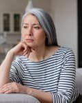 Sad depressed tired lonely divorced ill mother mature woman feeling unwell, unhealthy, suffering from midlife crisis on lockdown, social distance