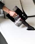 Vacuuming the mattress