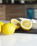 Lemons and juicer on kitchen counter